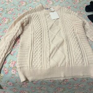 Aelfric Eden cream colored winter sweater.